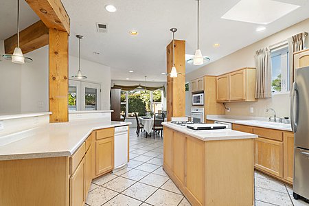 Open floorplan kitchen and dining area with view. Jenn air cook-top with griddle 