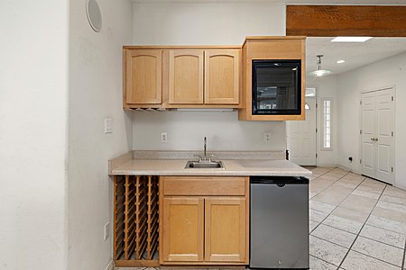 Entertainment area with wine cooler and refrigerator 