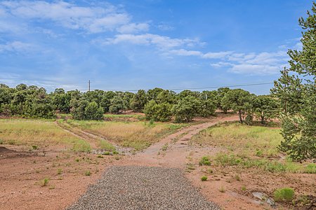 8.4 private acres with flat usable land and private well for gardening, expansion of horse facilities, arena, swimming pool or other expansion opportunity for the outdoor enthusiast