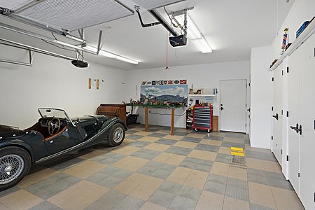 Garage (24 Feet Deep) with Upgraded Floor and Door to Back Yard Area