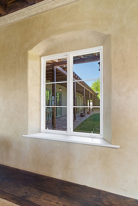 Custom plaster and accents around windows of Main house