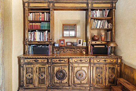 Custom built bookshelf and storage space in Sala