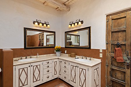 Custom built cabinets with dual sinks in the master bathroom