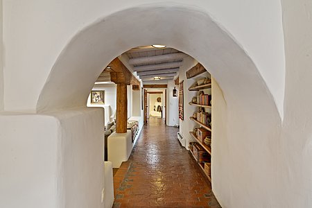 Archway onto living area from entry hall