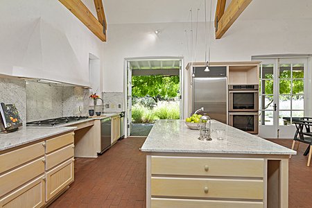Kitchen Has Multiple Doors Leading to Back Portal, Perfect for Outdoor Dining