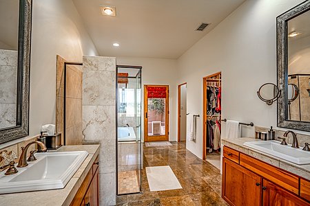Master Bath w/ Separate Sinks, looking to Closet & toilet chamber on the Right