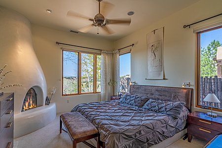 Master Bedroom with Kiva Fireplace, looking toward the view