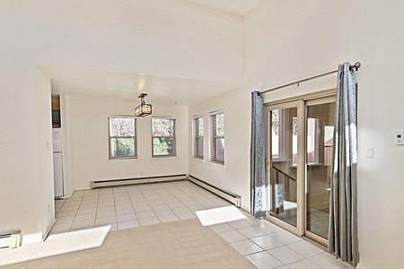 Dining room off kitchen with door into enclosed patio