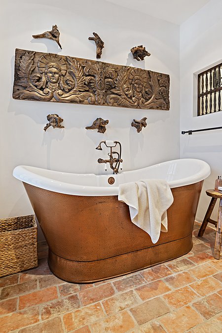 Luxurious master bathroom has a shower and glamour tub