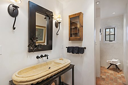 Fabulous hand hewn custom stone lavatory