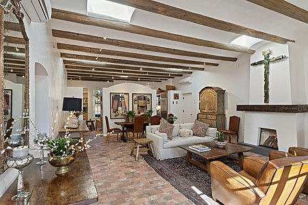 Living Living room with high coved ceilings brick floors lots of light