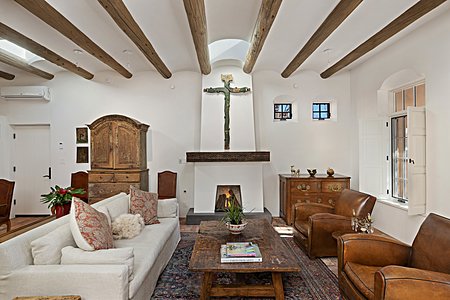 Handsome Living room with high coved ceilings brick floors lots of light