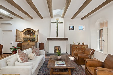 Living Living room with high coved ceilings brick floors lots of light