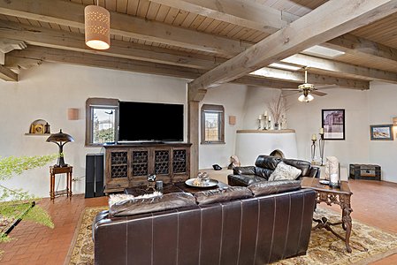 Living room with traditional brick floors, corbels and beams