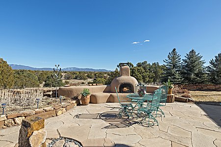 A Large Flagstone Patio with Kiva Fireplace and Mountain Views...