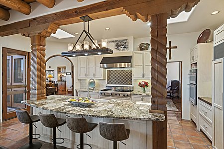 Gourmet Kitchen with Granite-topped Island and Counter Seating for Four...