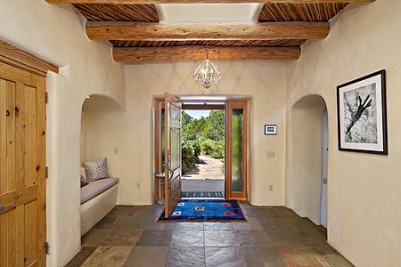 Bright Entry Foyer with Slate Tile Floor and Large Skylight...