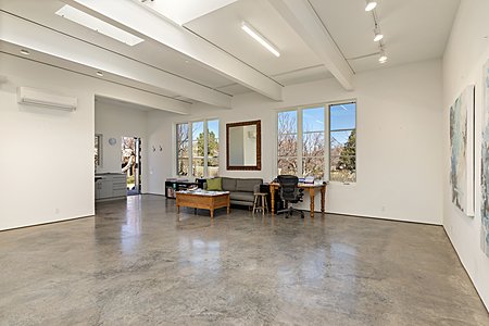 Studio work area with expansive north-facing windows