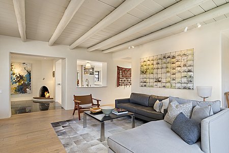 Family room with viga and plank ceilings, custom wood flooring