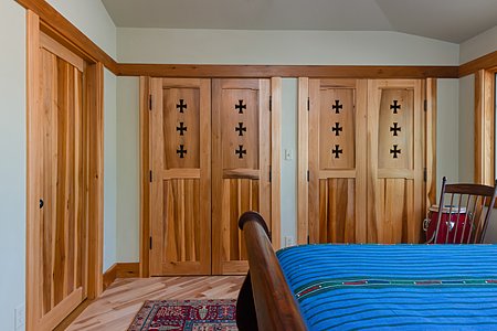 Second bedroom with hand carved closet doors