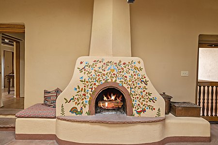 ...features a Fireplace hand-painted by Santa Fe Living Treasure Monica Sosaya Halford