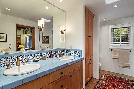 Colorful ceramic tiled dual vanity in guest bathroom 