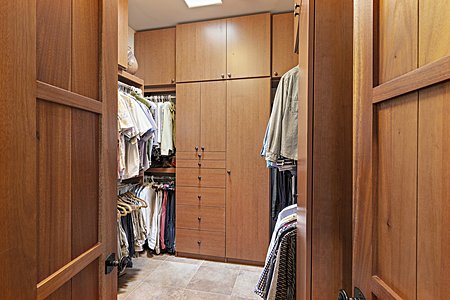 Custom built closet storage system in Master Suite walk in closet