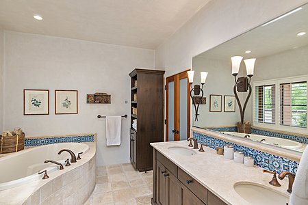Dual vanity and jetted soaking tub in Master Bath