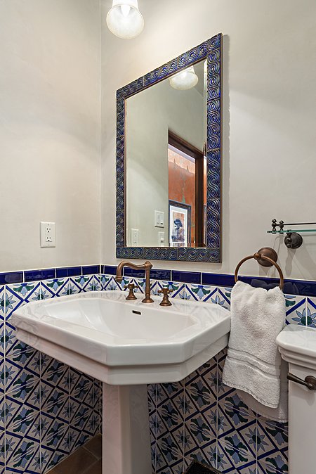 Porcelain sink and Tunisian tile in powder room