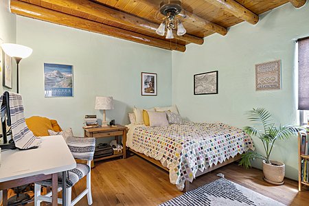 2nd Bedroom with Vigas and original hardwood floors