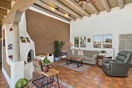 Grand Livingroom with Kiva Fireplace, Vigas, and Tile Floors