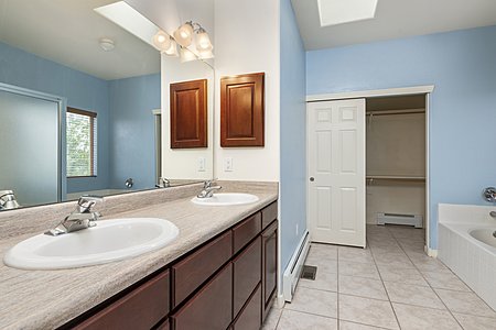 Owners bathroom with view of walk in closet