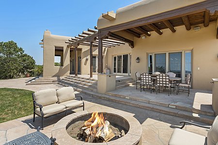 A fire pit accents one of the expansive outdoor areas