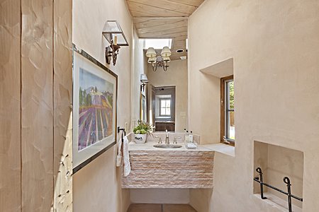 Powder room with Anasazi inspired stone basin