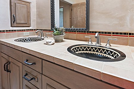 Detail of dual artisan sinks in second guest suite bath