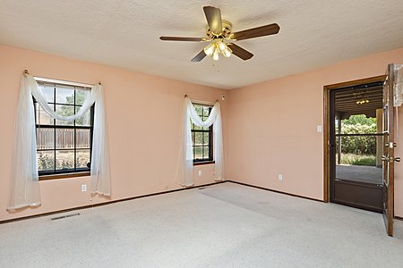 Primary bedroom with access to backyard