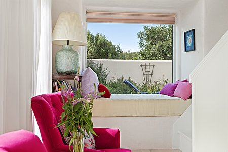 Master Suite window seat with view of secret garden