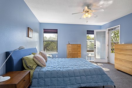 Primary Bedroom with access to private balcony