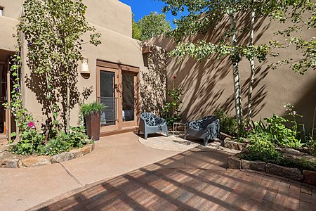 Wide open entry courtyard is beautifully landscaped