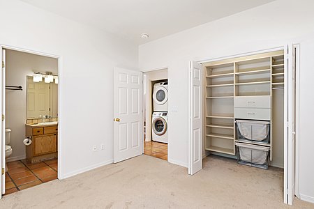 Downstairs bedroom with built in closet system