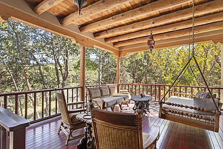Outside, sip and swing and listen to the birds sing on the private, lush, nearly tropical mahogany master deck surrounded by lush pinons year round! 