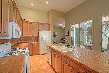 An open kitchen layout includes tremendous storage and offers the chef conversation, natural light and views
