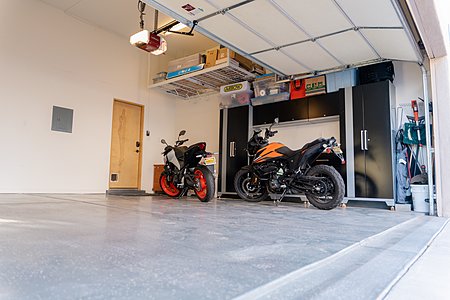 Garage has newer epoxy flooring, and lots of storage 