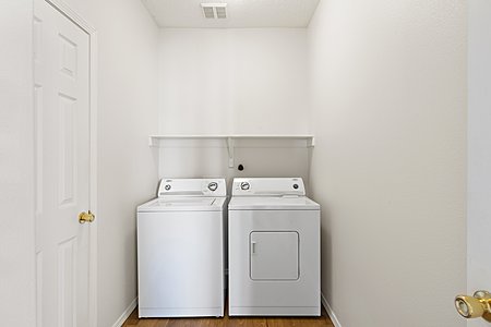 Utility Room with washer and dryer also has a small closet