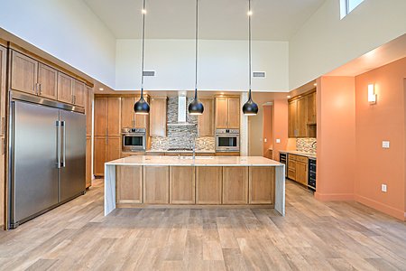 Kitchen with double ovens, and cascade island with storage 