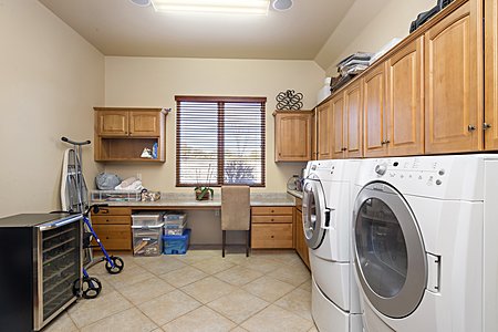 Large Utility room, laundry, sink, overhead cabinets, desk and prep table