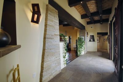 Hand stacked Chaco walls flagstone floors  lit nichos  and fabulous ceilings