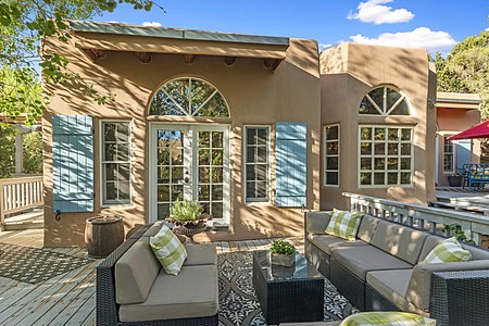 Welcome to 2208 Paseo Primero w a spacious outdoor deck & fan-light windows at the Casual Den & Dining Area