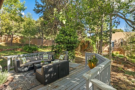 Spacious outdoor deck, showing the heavily treed & beautifully landscaped yard 