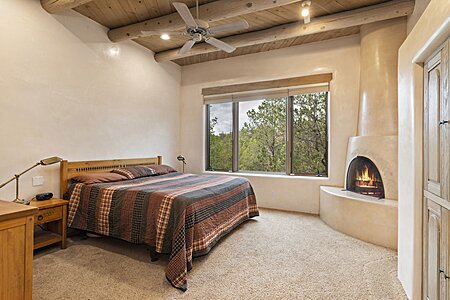 Primary bedroom with Kiva Fireplace